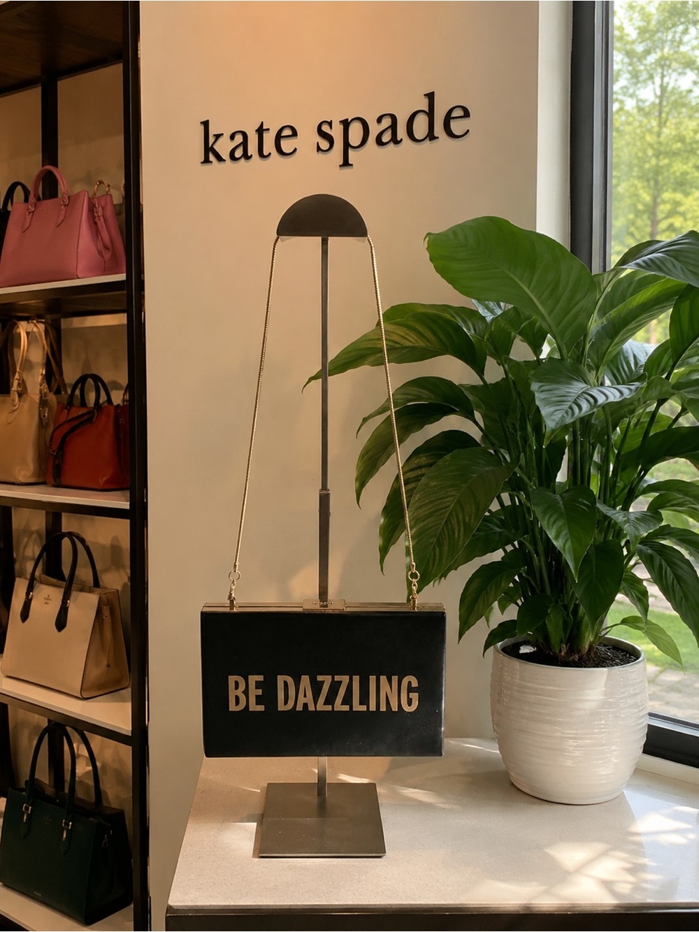 kate spade black box clutch with gold lettering